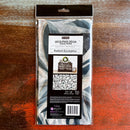 A package of ReDesign with Prima's Radiant Eucalyptus tissue paper is against a dark wood background.