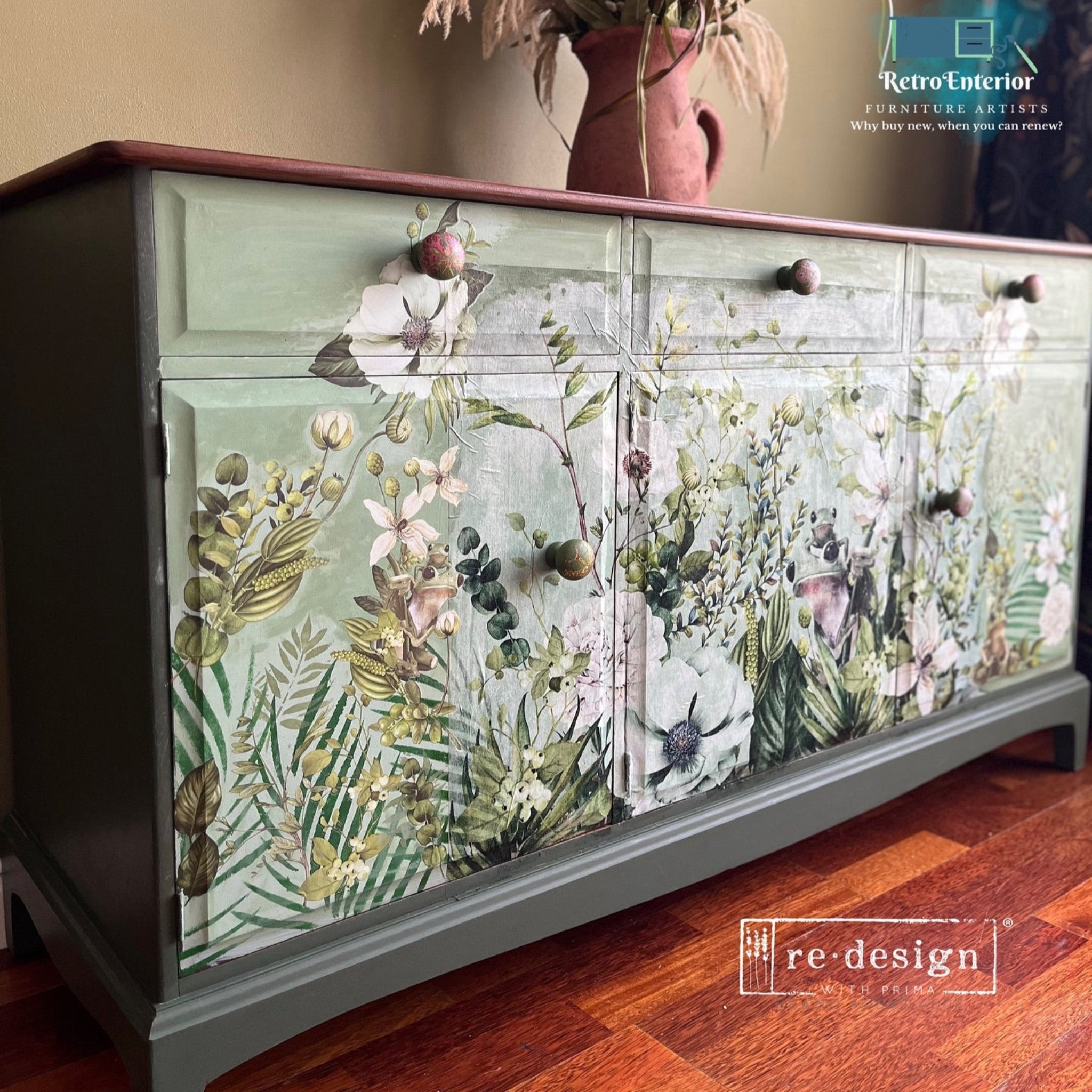 A vintage buffet cabinet refurbished by Retro Enterior is painted light green and features ReDesign with Prima's Froggy Meadow Greens fiber paper on the front.