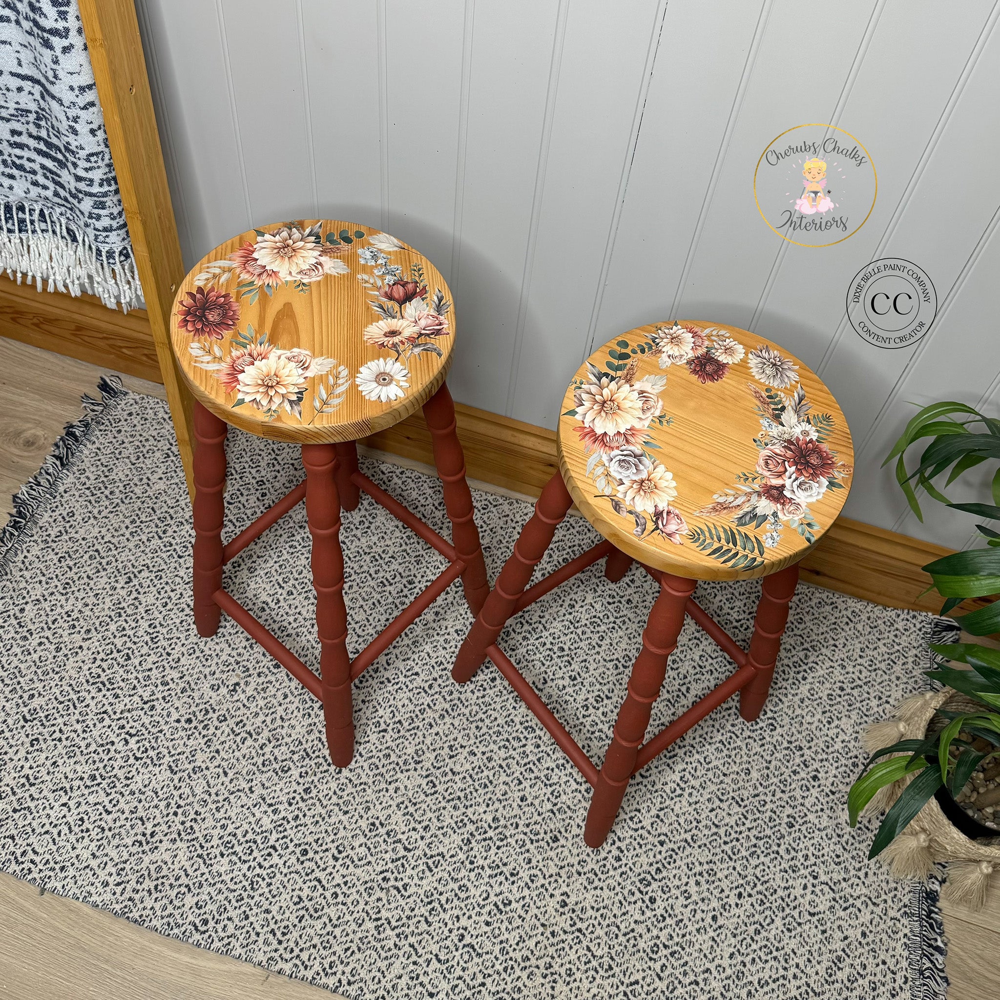 Two wood stools refurbished by Cherub's Chalks Interiors feature Belles & Whistles' Autumn Morning Meadow small transfer on the seats against natural wood.