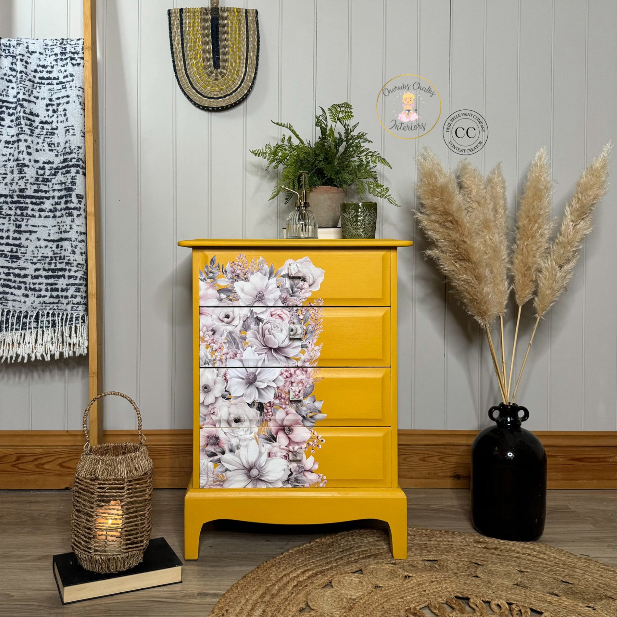 A vintage 4-drawer chest dresser is painted mustard yellow and features Belles & Whistles' Soft Wintery Floral rub-on transfer on the left front of the drawers.