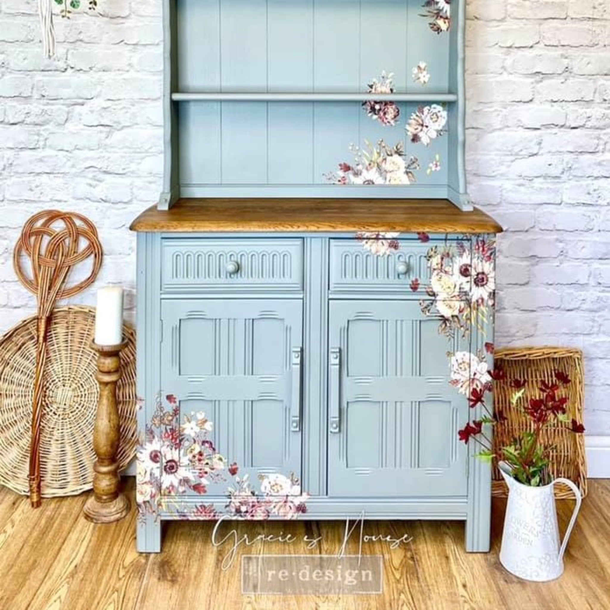 A country style hutch cabinet refurbished by Gracie's House is painted pale blue and features ReDesign with Prima's Sunflower Farms transfer on it.