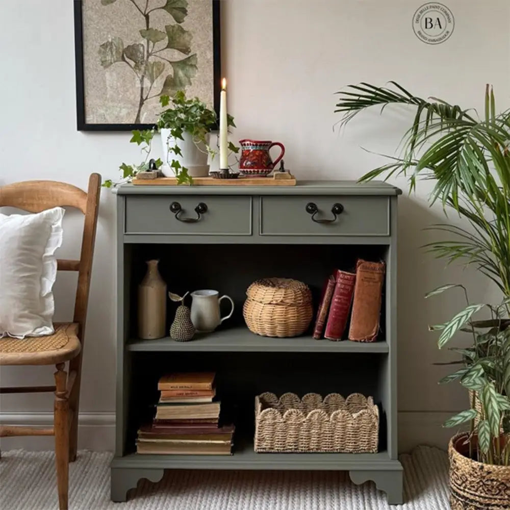 A 4-drawer chest dresser turned into a small console table with 2 small drawers is painted in Dixie Belle Thicket Chalk Mineral Paint.