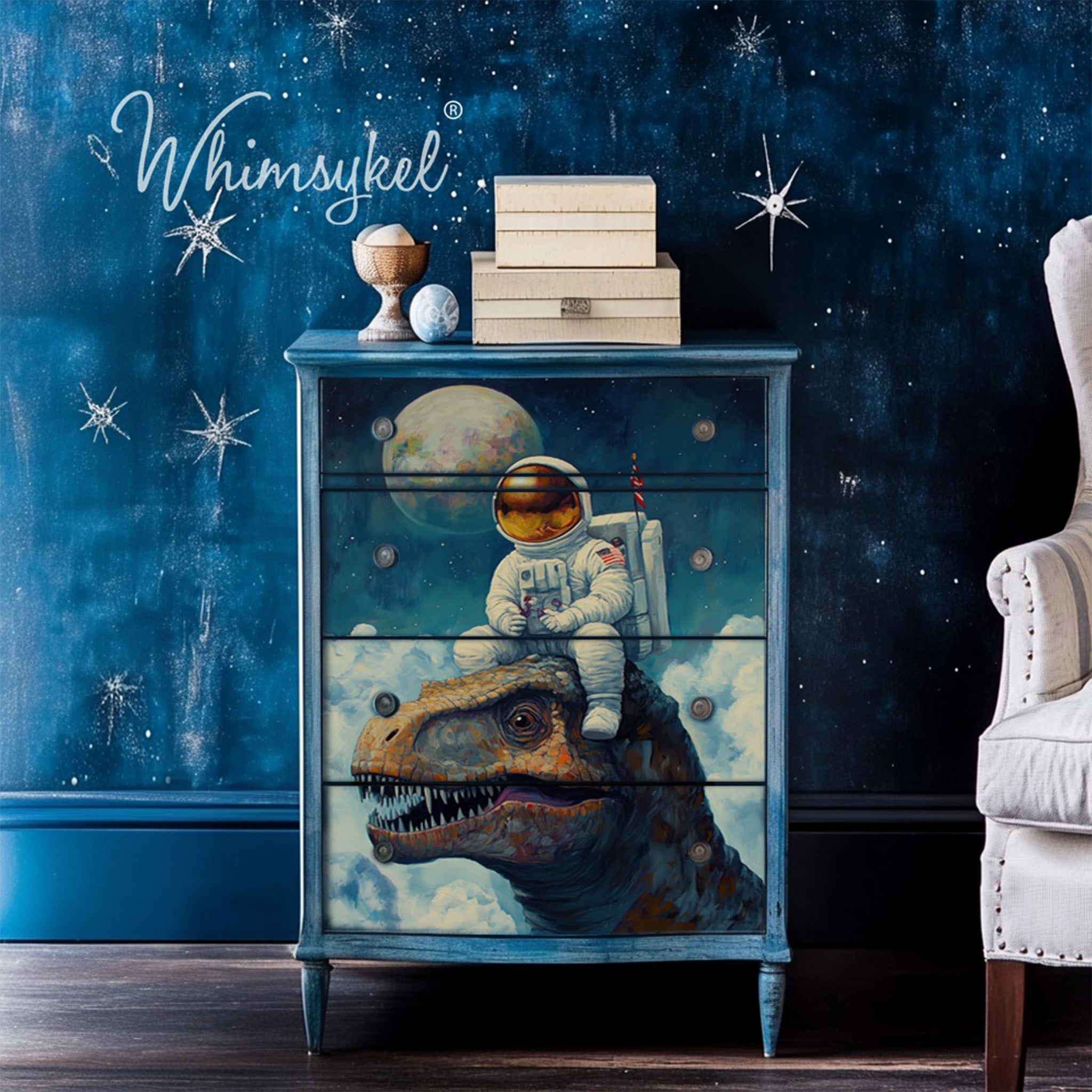 A 4-drawer chest dresser is painted blue and features Whimsykel's Astronaut Dreams tissue paper on the drawers.