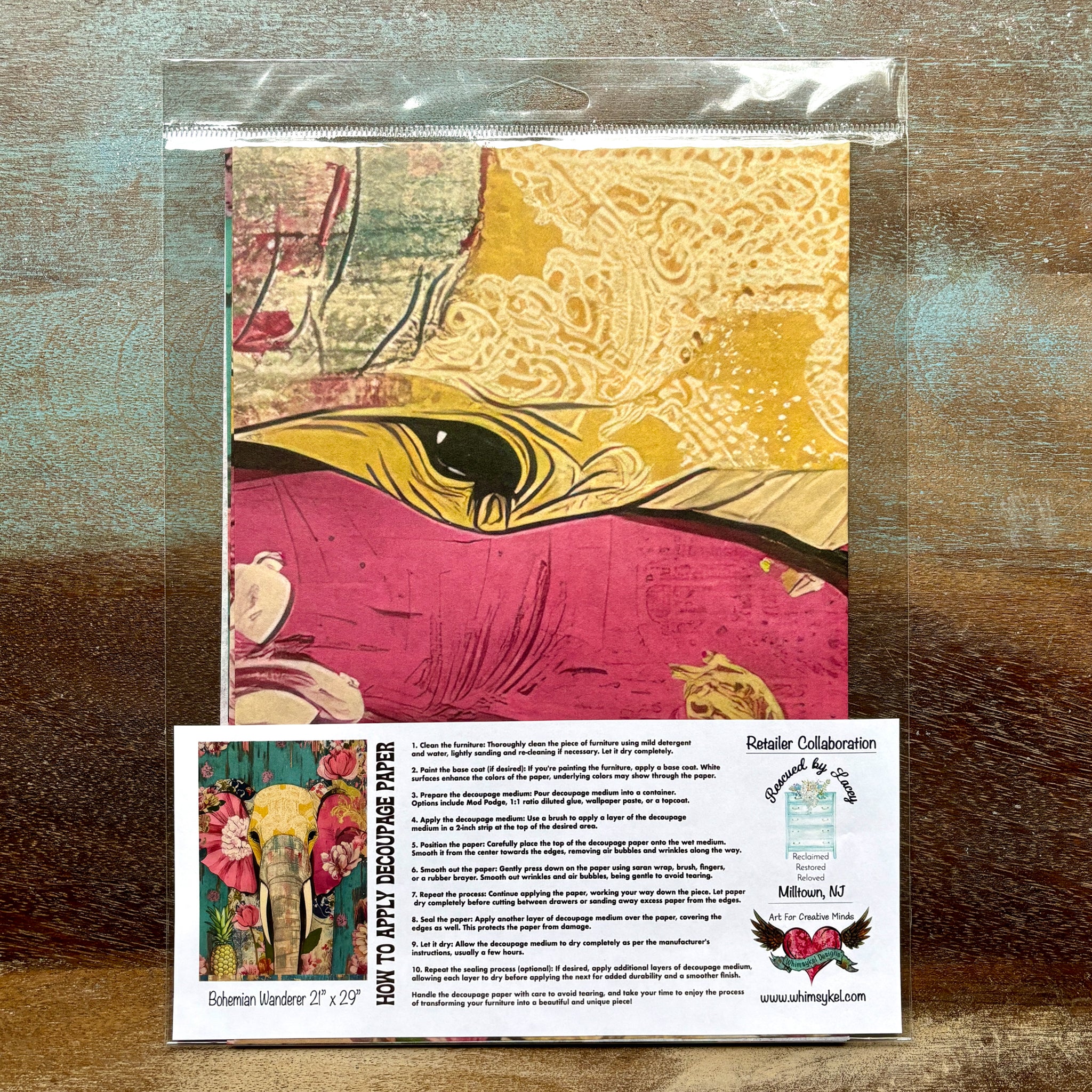 A package of Whimsykel's Bohemian Wanderer tissue paper is against a wood background.