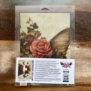 A package of Whimsykel's Butterfly Whisperer tissue paper is against a wood background.