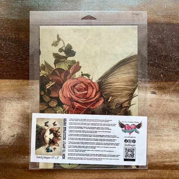 A package of Whimsykel's Butterfly Whisperer tissue paper is against a wood background.