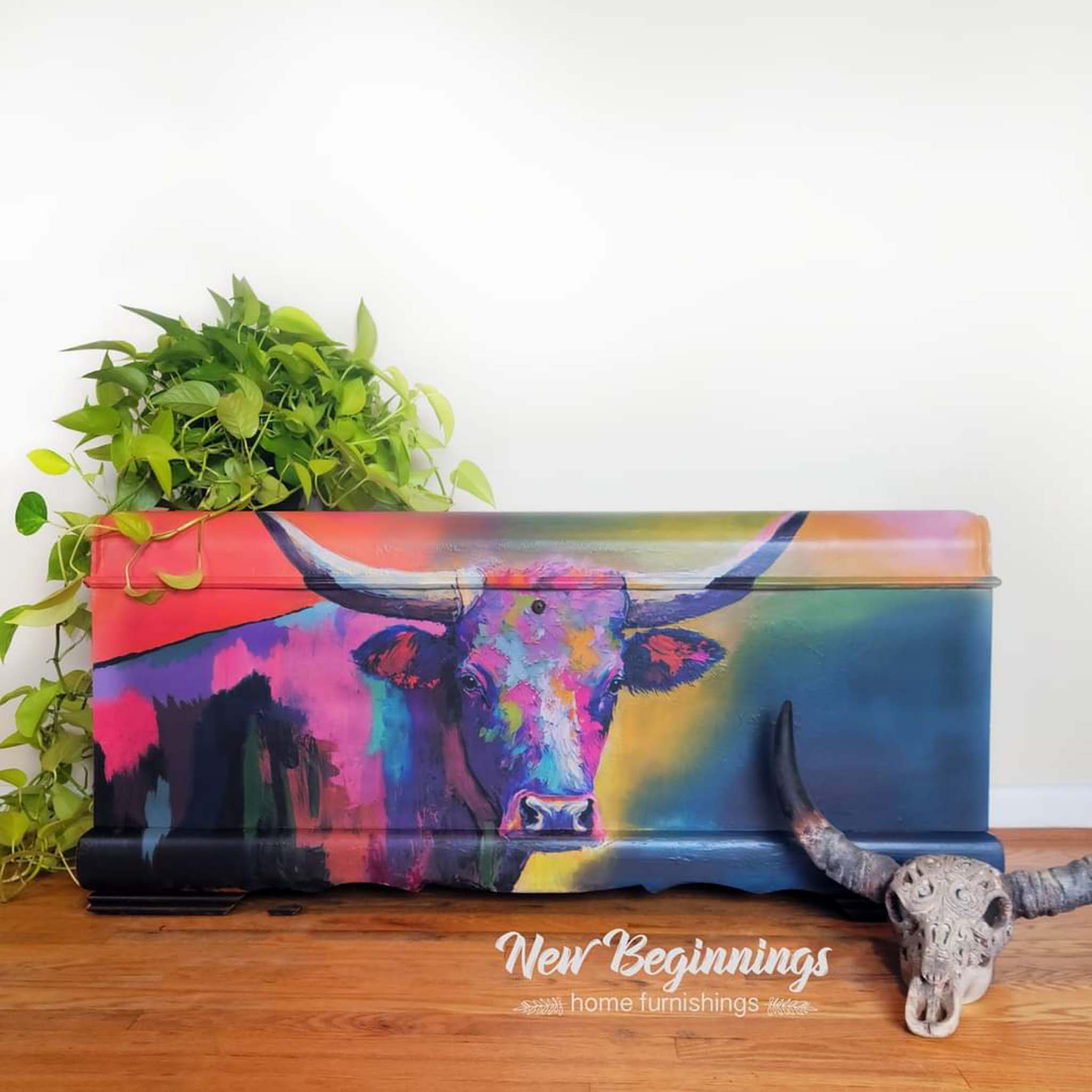 A storage chest refurbished by New Beginnings Home Furnishings features Whimsykel's Dottie Longhorn tissue paper covering it.