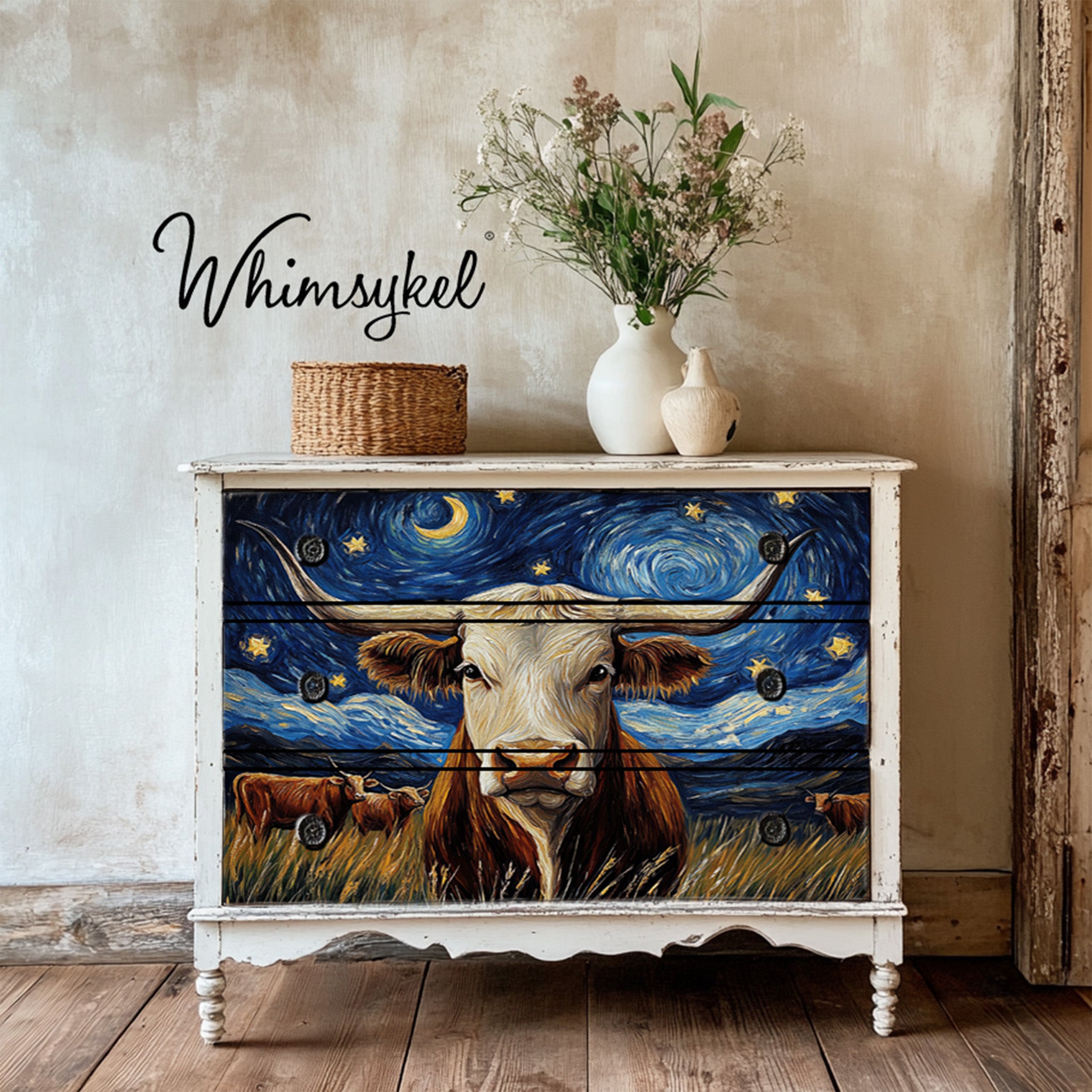 A vintage 3-drawer dresser is painted white and features Whimsykel's Galaxy Grazing tissue paper on the front.