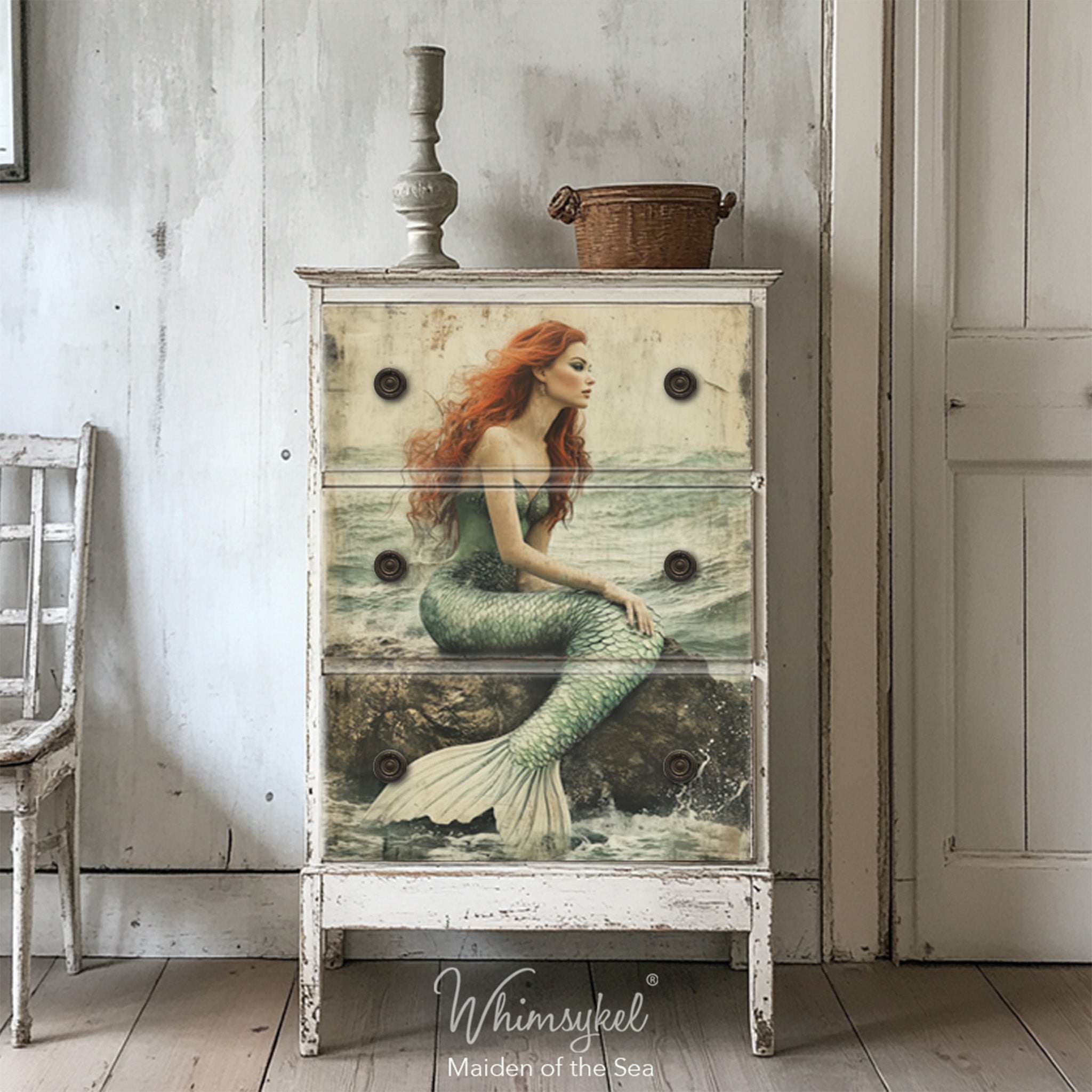 A vintage 3-drawer chest dresser is painted white and features Whimsykel's Maiden of the Sea tissue paper on the drawers.