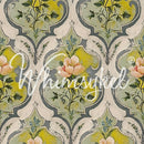 Close-up of a tissue paper featuring a soft pink floral design in a damask-style repeating pattern in vintage green and yellow hues.