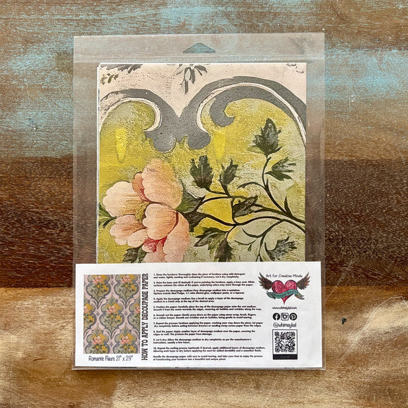 A package of Whimsykel's Romantic Fleurs tissue paper is against a wood background.