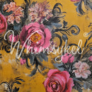 Close-up of a tissue paper featuring paintings of pink rose bouquets against a mustard yellow background.