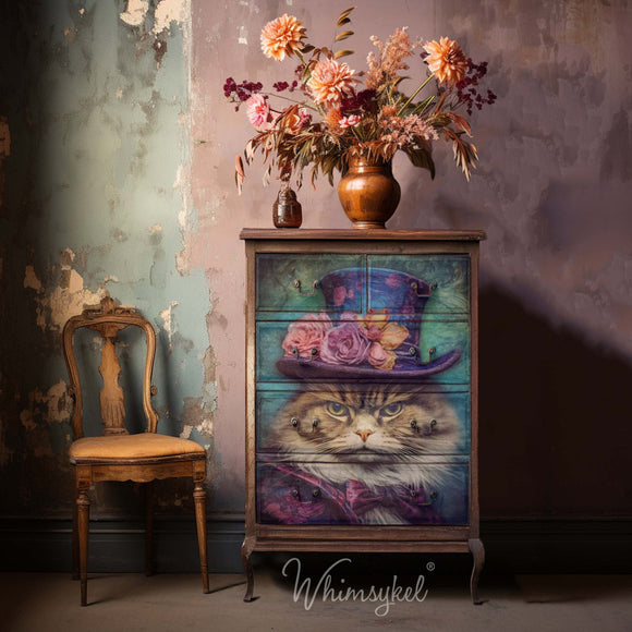 A mock-up of a vintage chest dresser created by Whimsykel is natural brown wood and features their Sour Puss tissue paper on its 5 drawers.