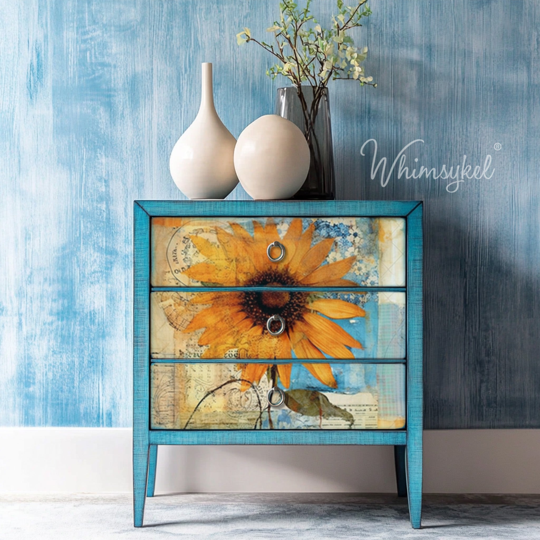 A 3-drawer nightstand is painted sky blue and features Whimsykel's Sunflower Collage tissue paper on the drawers.