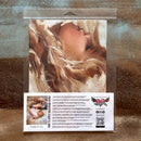 Packaged art print of a woman with flowing hair on a textured brown background