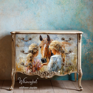 Decorative dresser with artwork of two girls and a horse, branded 'Whimsykel'.