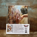 Product packaging with a horse illustration and application guide on a textured surface