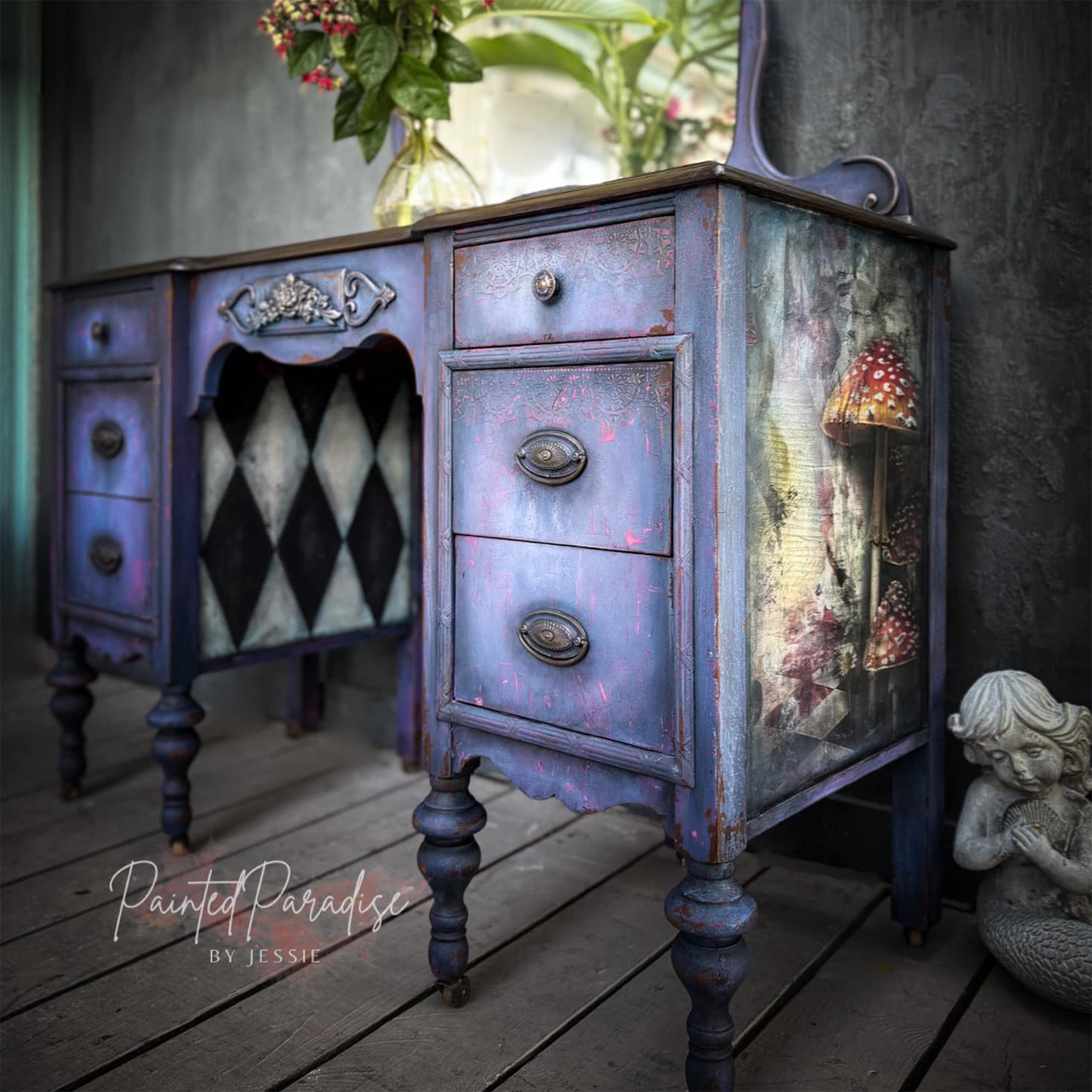 A vintage desk refurbished by Painted Paradise by Jessie is painted purple and features Whimsykel's Wonderland tissue paper on the side.