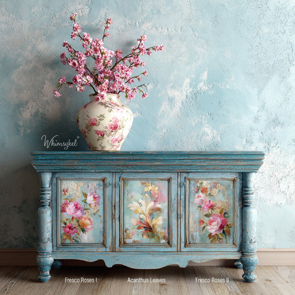 Whimsykel Fresco Roses I, Acanthus Leaves, and Fresco Roses II decoupage papers on a blue painted cabinet