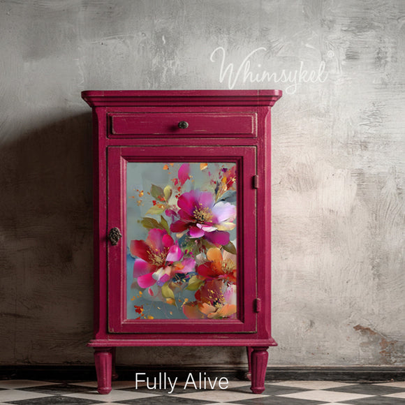 Whimsykel Fully Alive decoupage paper on a cabinet door mockup with a rich magenta painted finish and vintage-style hardware