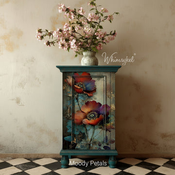 Whimsykel “Moody Petals” tissue decoupage paper applied to a teal cabinet door, featuring moody poppy blooms with teal foliage and vintage crackle texture.