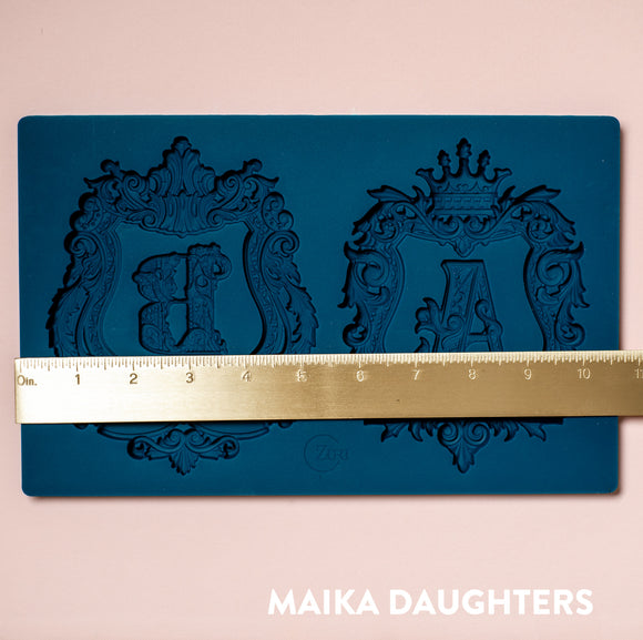 Zuri A&B monogram silicone mold with ruler showing width and two ornate framed letters
