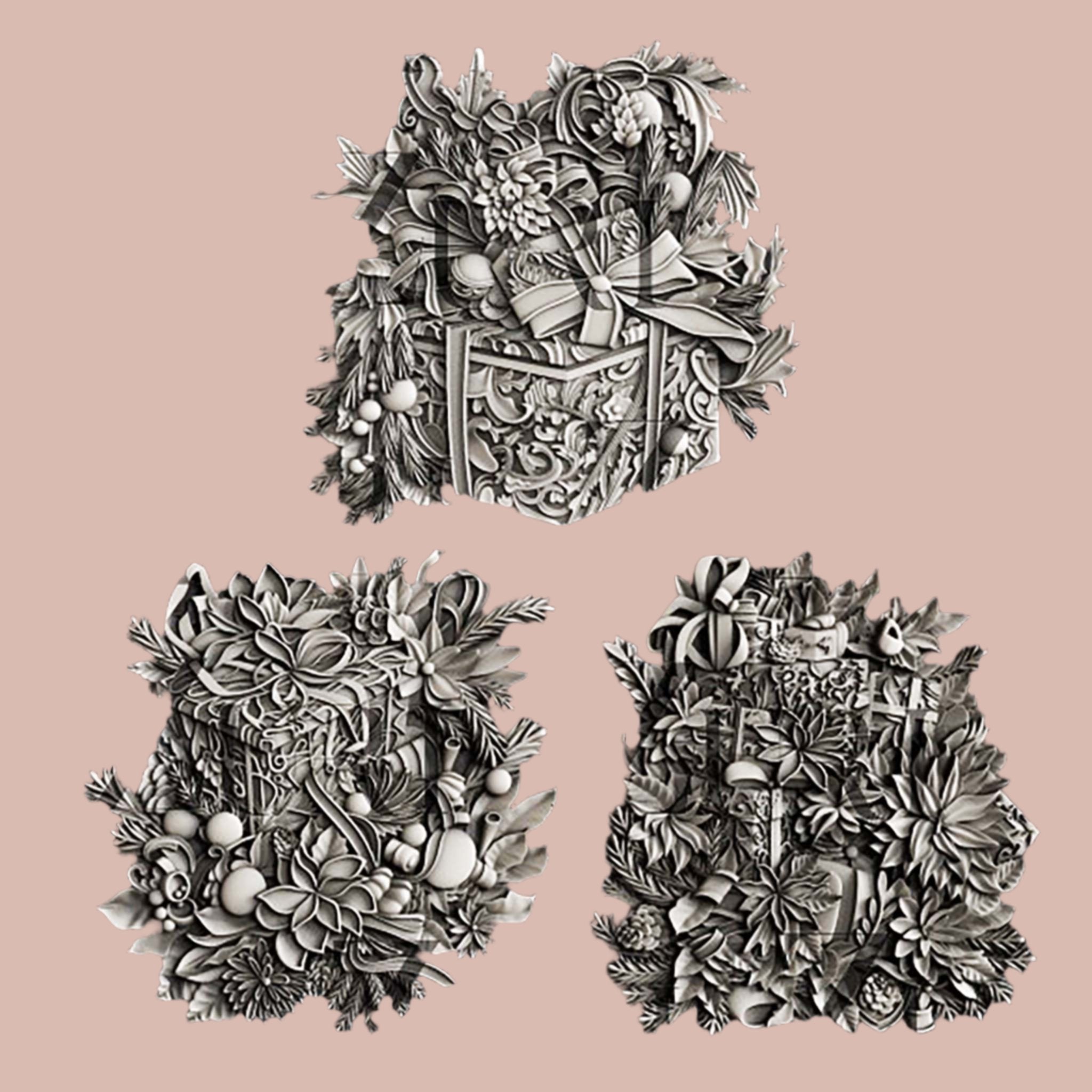 Silver colored silicone mold castings featuring 3 ornately decorated gift boxes covered in holiday bouquets are against a light pink background.