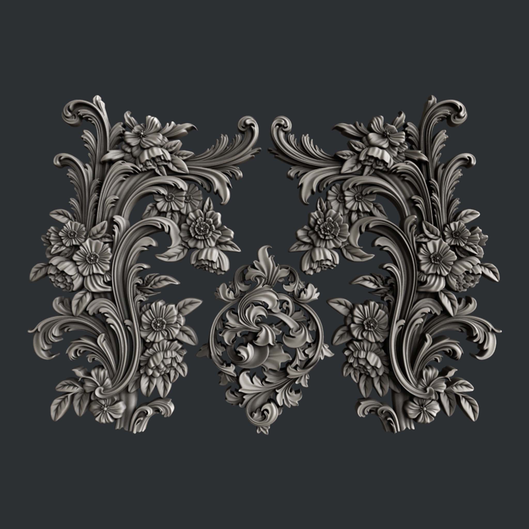 Silver colored silicone castings of 3 ornate scroll floral accent pieces are against a dark grey background.