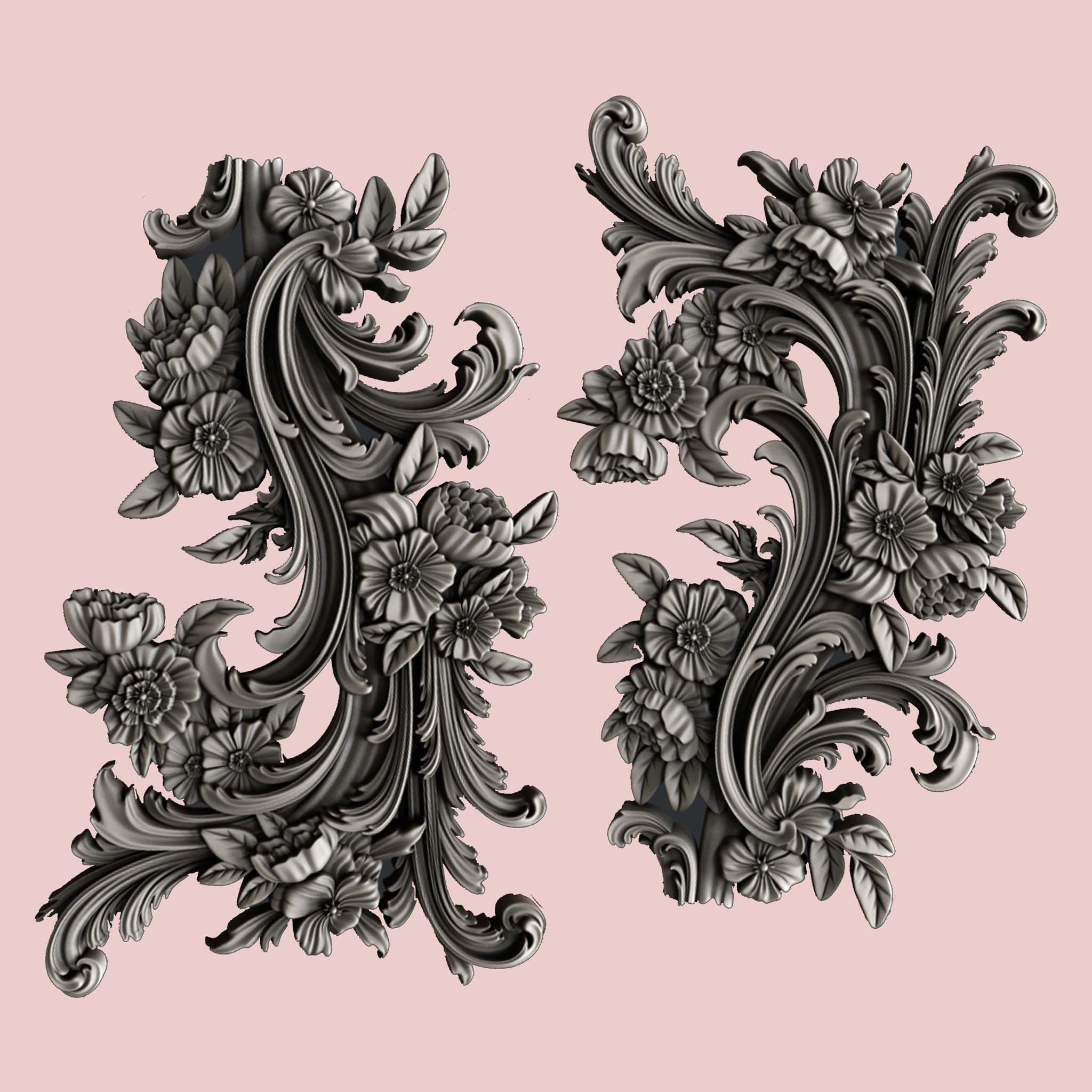 Silver colored silicone mold castings featuring 2 small ornate floral flourish accent pieces are against a light pink background.