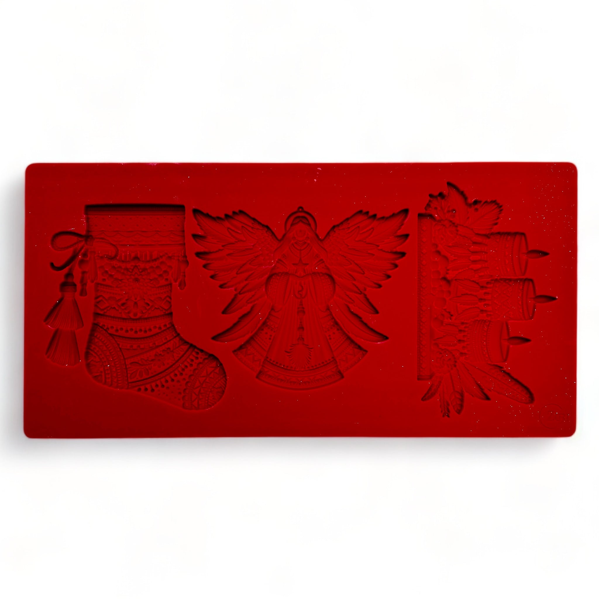 A red silicone mold of Zuri's Design's Bohemian Christmas Decor is against a white background.