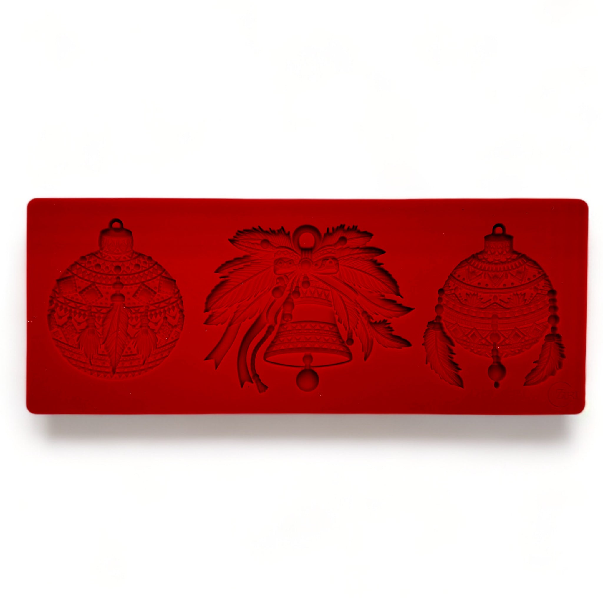 A red silicone mold of Zuri Design's Bohemian Christmas Ornaments is against a white background.