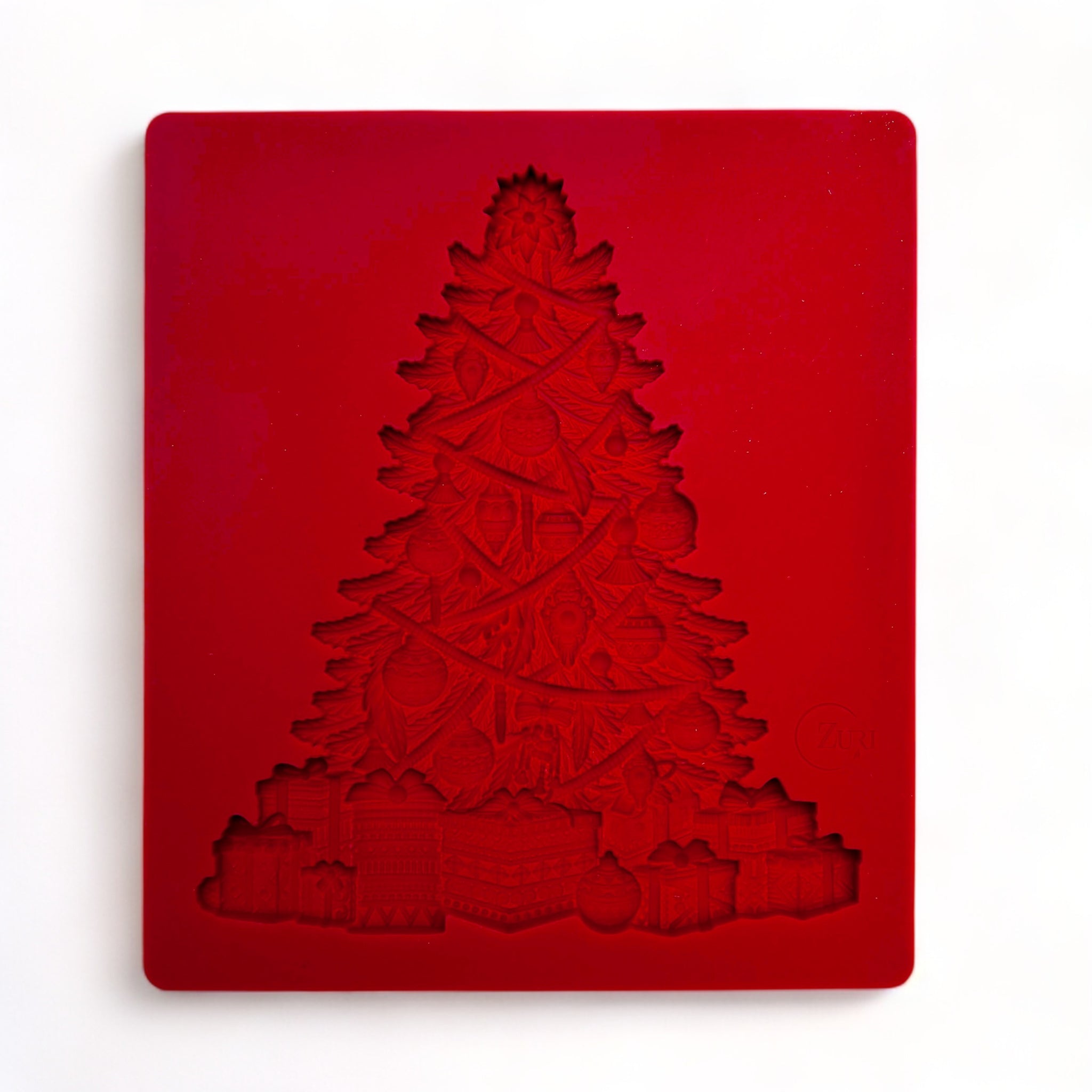 A red silicone mold of Zuri Design's Bohemian Christmas Tree is against a white background.