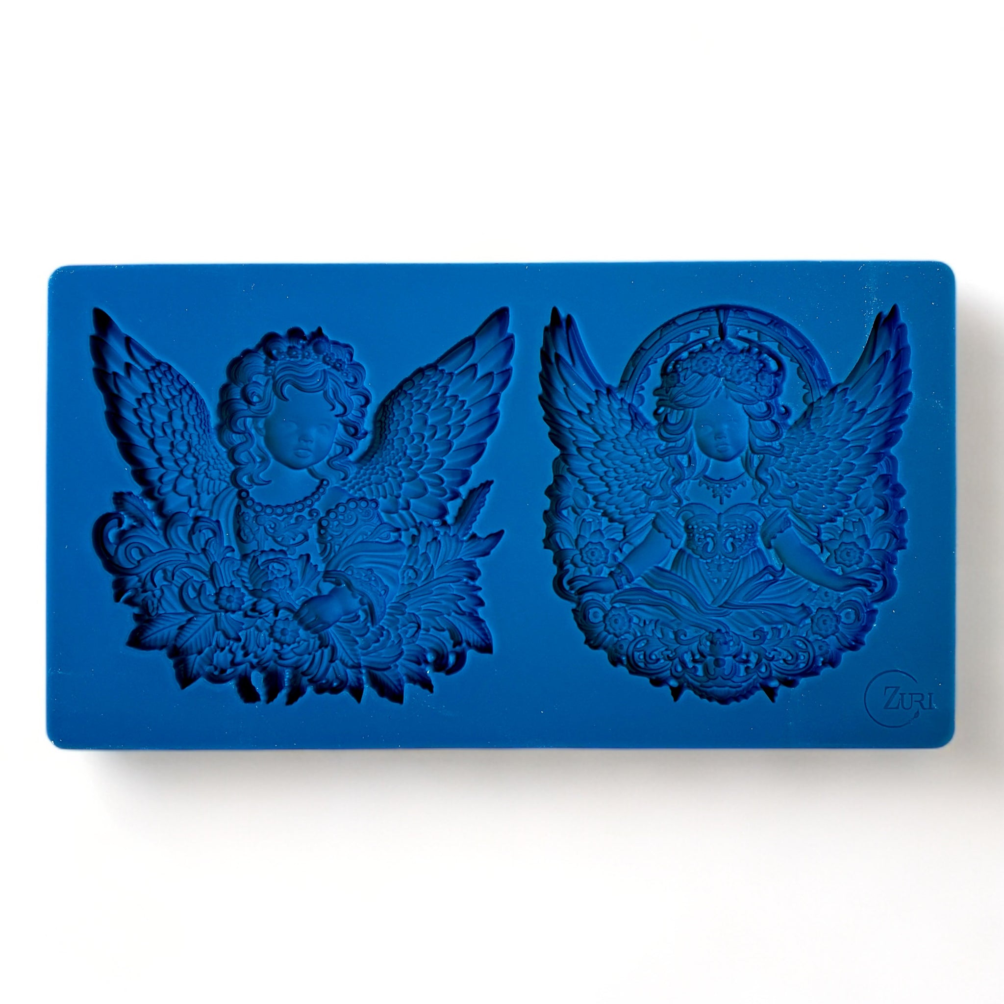 A blue silicone mold featuring 2 ornately designed cherub angels is against a white background.