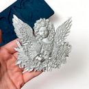 Finished cast cherub with wings and floral base detail made using the Zuri Cherub Twins silicone mold