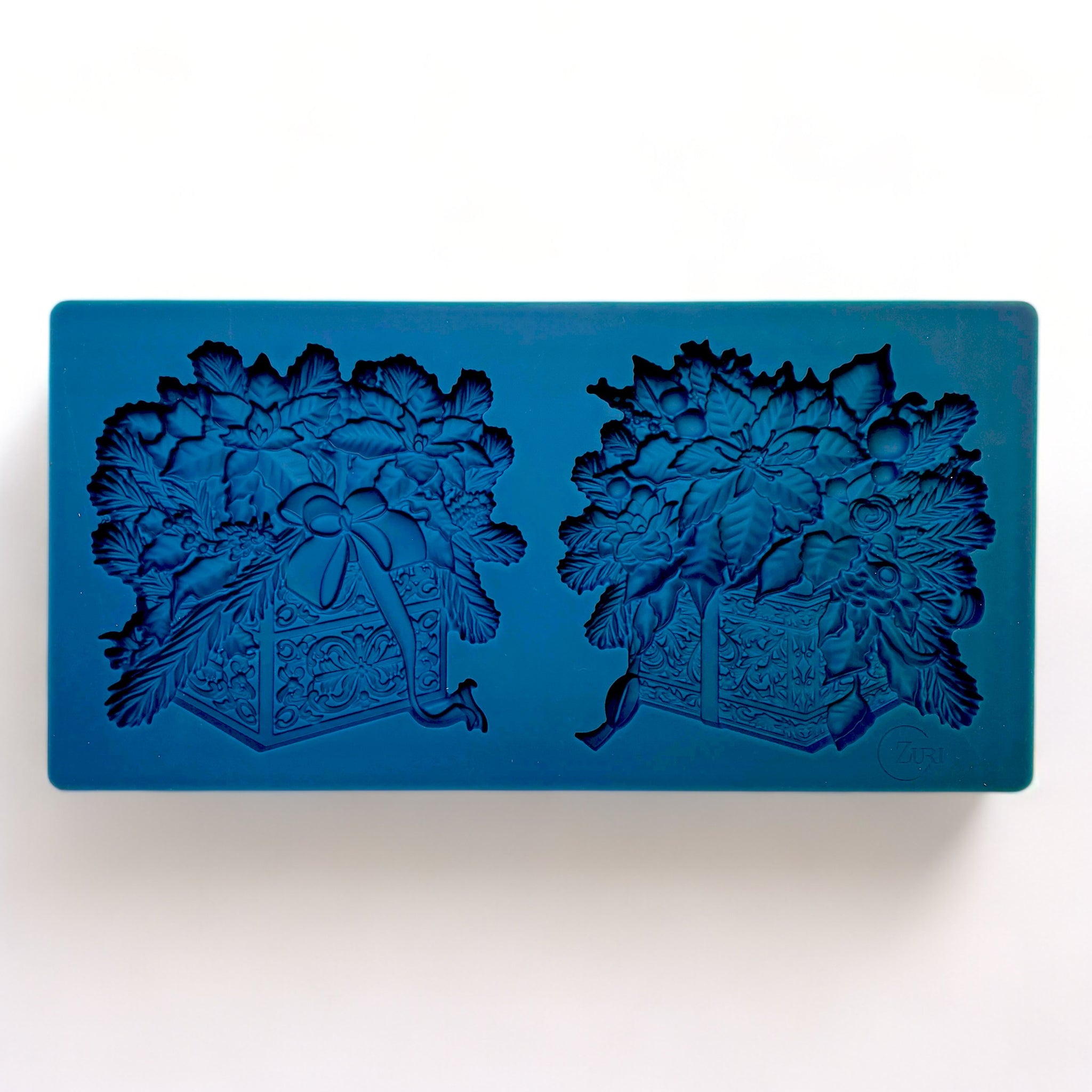 A blue silicone mold of Zuri Design's Christmas Gifts Set 1 is against a white background.