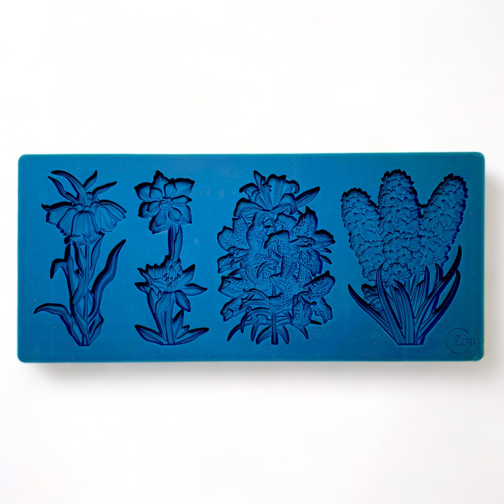 A blue silicone mold of Zuri Design's Flower Blooms Set is against a white background.