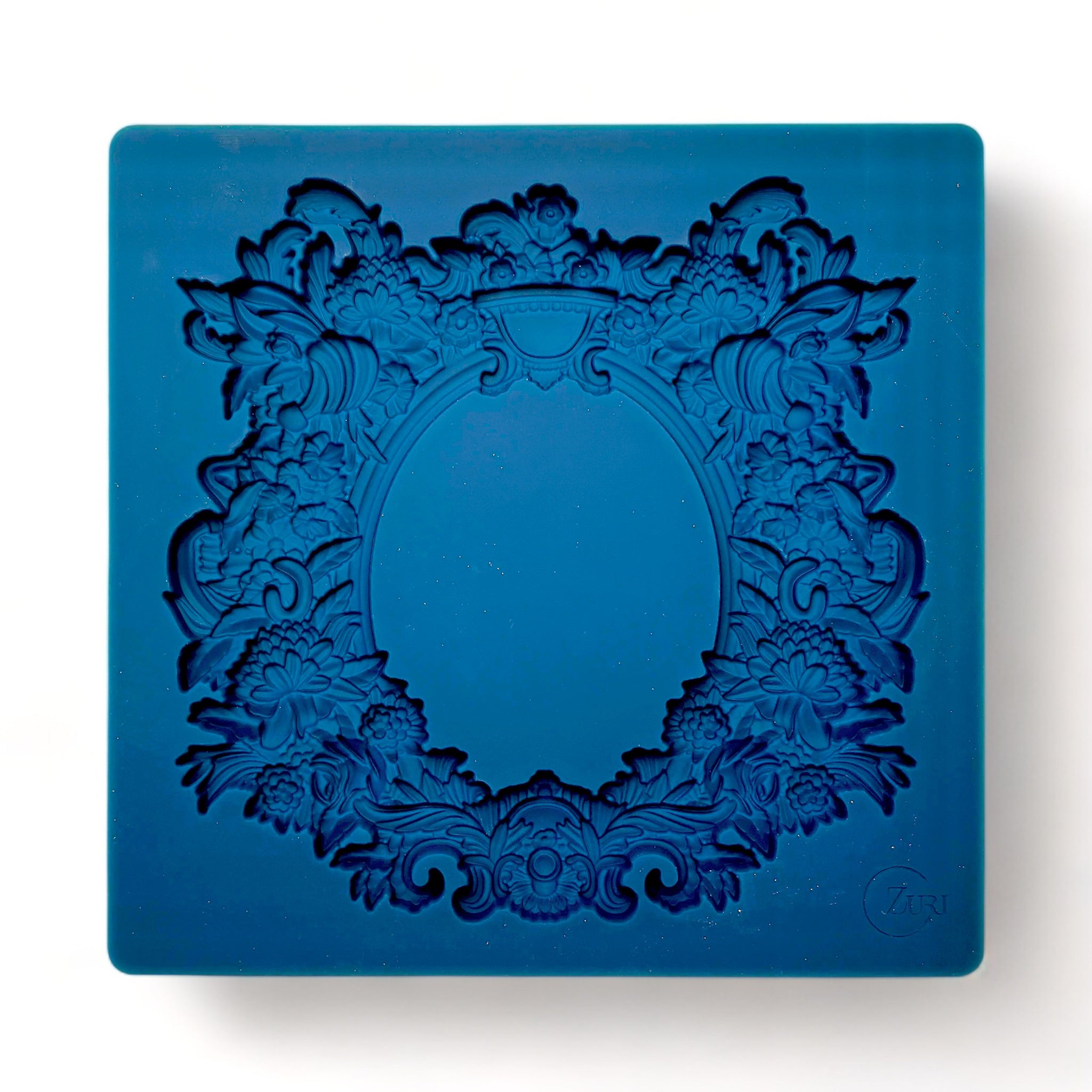 A blue silicone mold of Zuri Design's Oval Floral Frame is against a white background.