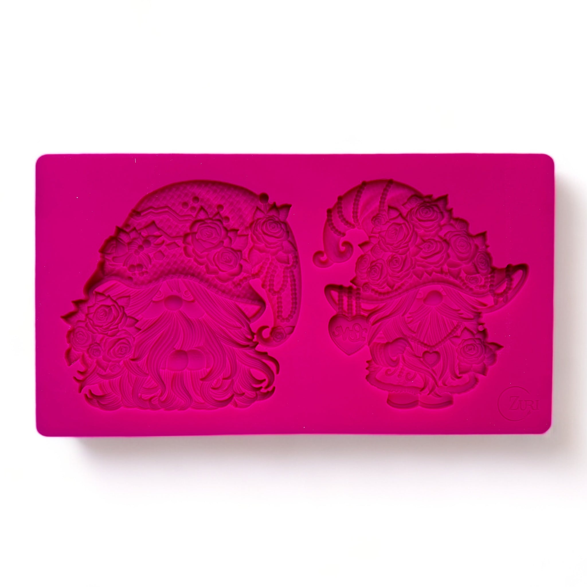 A pink silicone mold of Valentine's Day themed gnomes is against a white background.