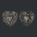 Two detailed floral heart frame castings from Zuri Floral Lovehearts mold on dark background