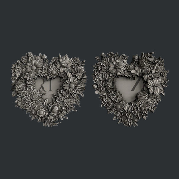 Two detailed floral heart frame castings from Zuri Floral Lovehearts mold on dark background