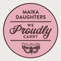 A white background with a pink circle, brown outline, and brown text that reads: Maika Daughters. We proudly carry Finnabair (using the Finnabair moth logo).