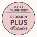 A white background with a pink circle with a brown outline and brown text reading: Maika Daughters. ReDesign Plus Retailer.