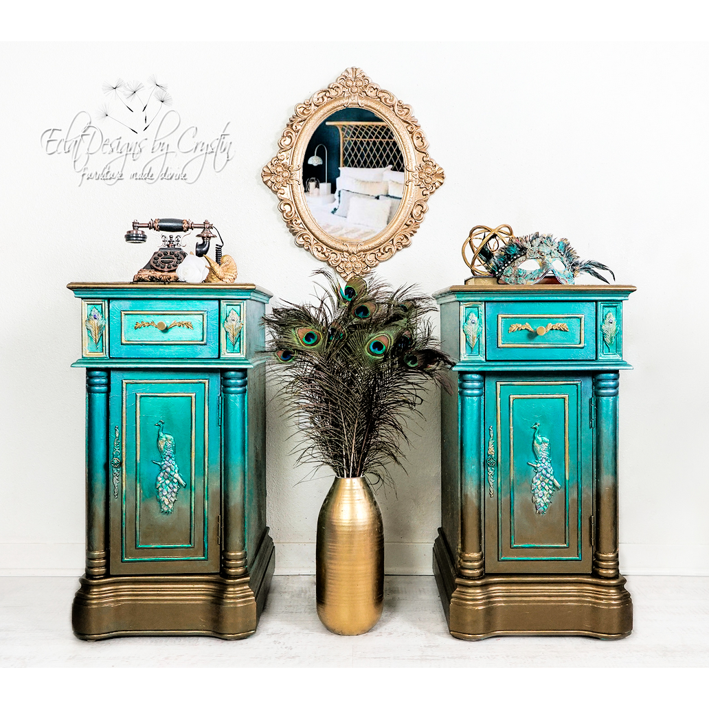 Two blue and gold ombre furniture pieces with the regal peacock mold in the center. A white logo is in the top right right reading: Eclat Designs by Crystin furniture made divine.