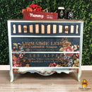 White and navy dresser with the ruby rose transfer on the drawers. A Coco Restyled vintage plus modern logo on the bottom right.