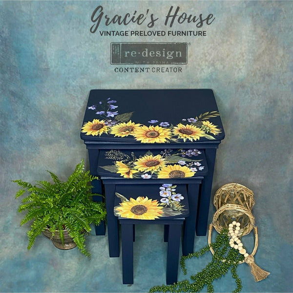 Three dark navy blue tables with the Sunflower Fields transfer on top. A gray Gracie's House vintage Preloved Furniture Redesign content Creator logo at the top.
