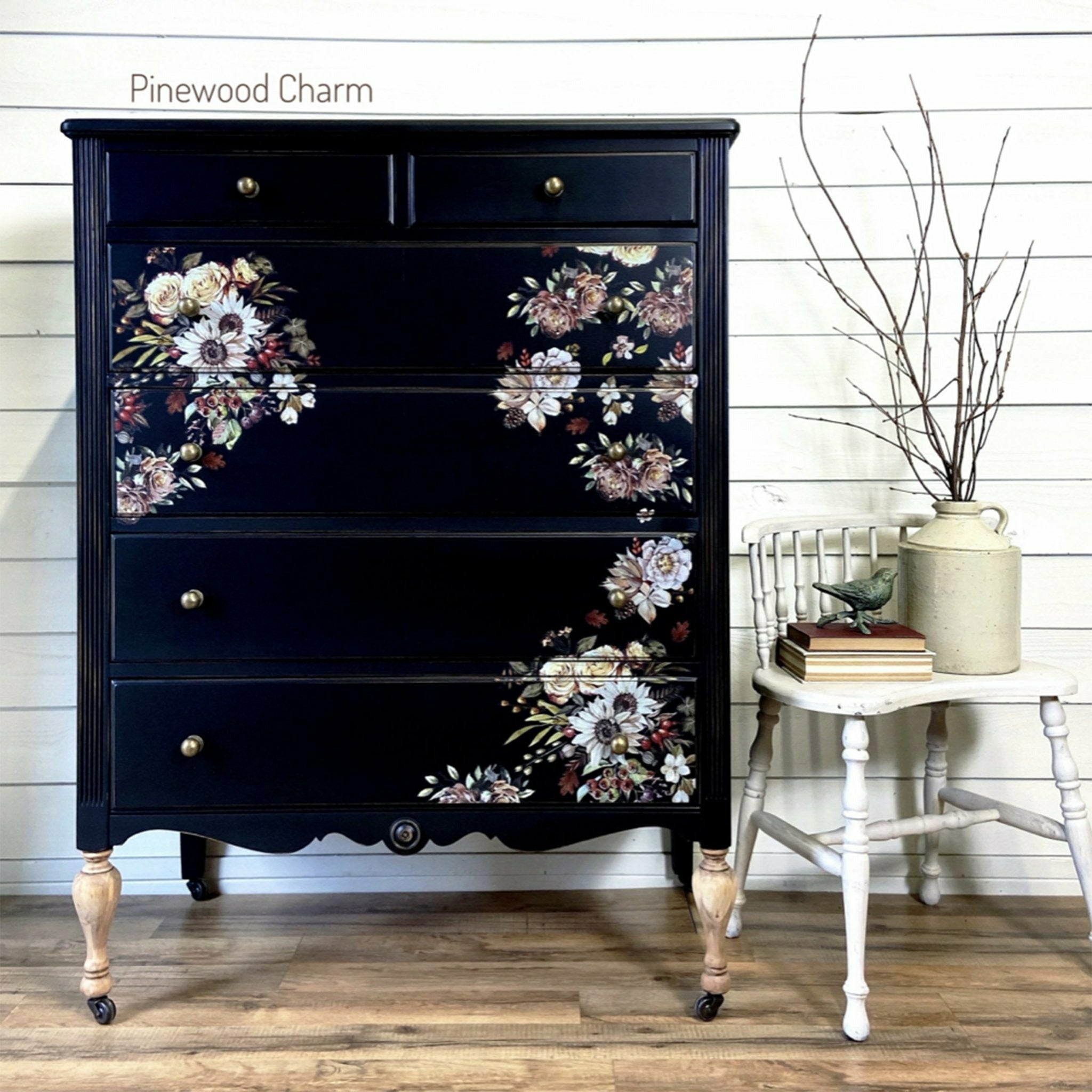 A navy blue dresser with the Sunflower Farms transfer on top. A brown Pinewood Charm logo on the top left.