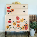 Tan dresser with the Poppy Garden transfer on top. A white Rustic Owl Furnishings logo on the right.
