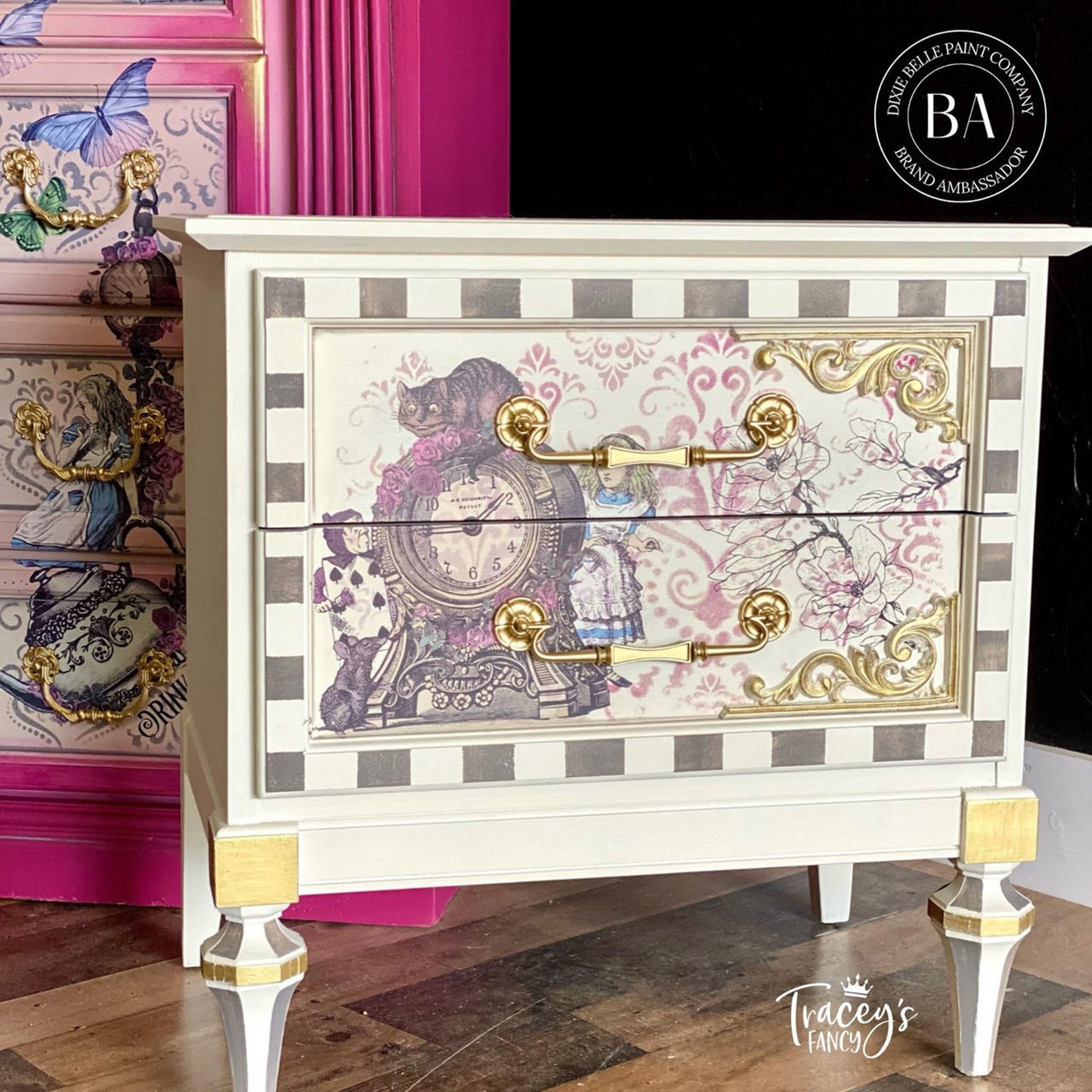 A 2-drawer nightstand refurbished by Trancey's Fancy, A Dixie Belle Paint Company Brand Ambassador, is painted a cream color and features parts of the Alice Part 2 transfer on the drawers.