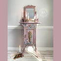 A tall, skinny vintage vanity refurbished by The Top Drawer, A Dixie Belle Paint Company Brand Ambassador, is painted a mauve pink and features the Cotton and Eucalyptus transfer.