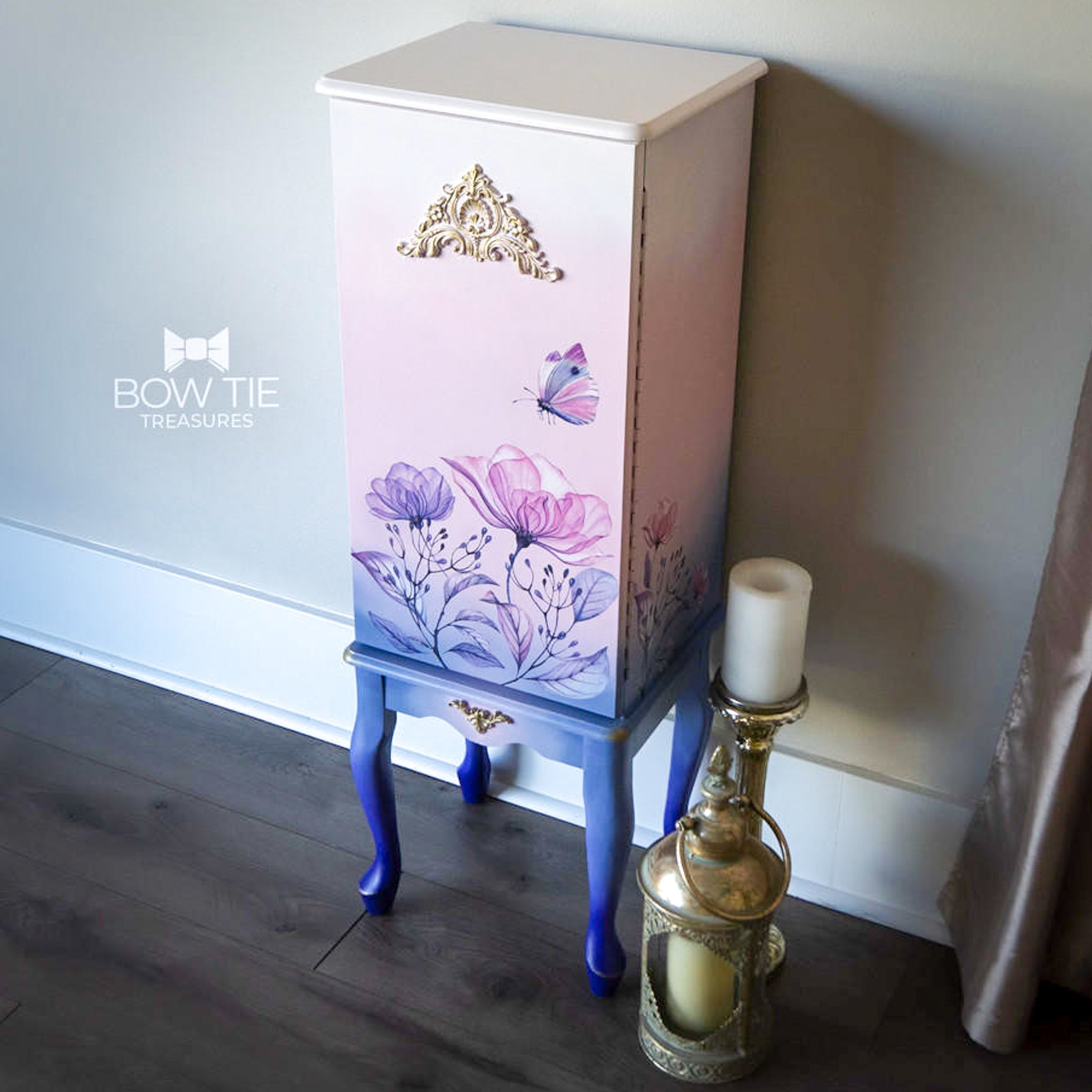 A vintage standing jewelry box refurbished by Bow Tie Treasures is painted a blend of light pink and blue  and features the Translucent Gardens Transfer on it.